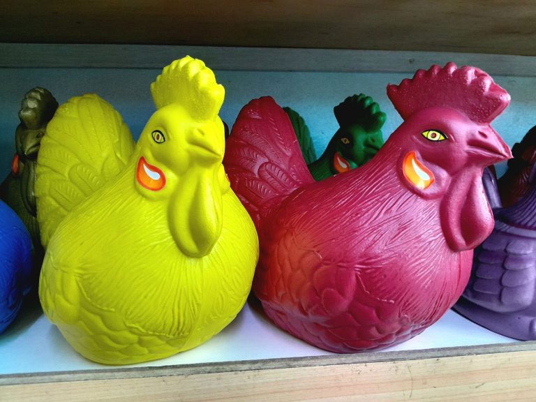 Colourful chicken-shaped piggy banks used for household savings
